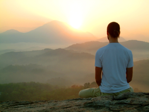6 Tips to Make the Most of Your Recovery - man meditating at sunset