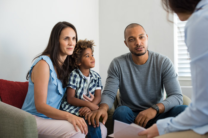 couple with young child at therapy session