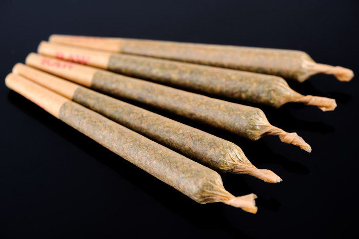 five marijuana joints rolled in natural hemp paper