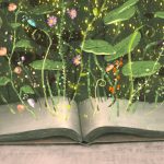 illustration of open book with flowers and plants growing up out of the pages - inspirational books